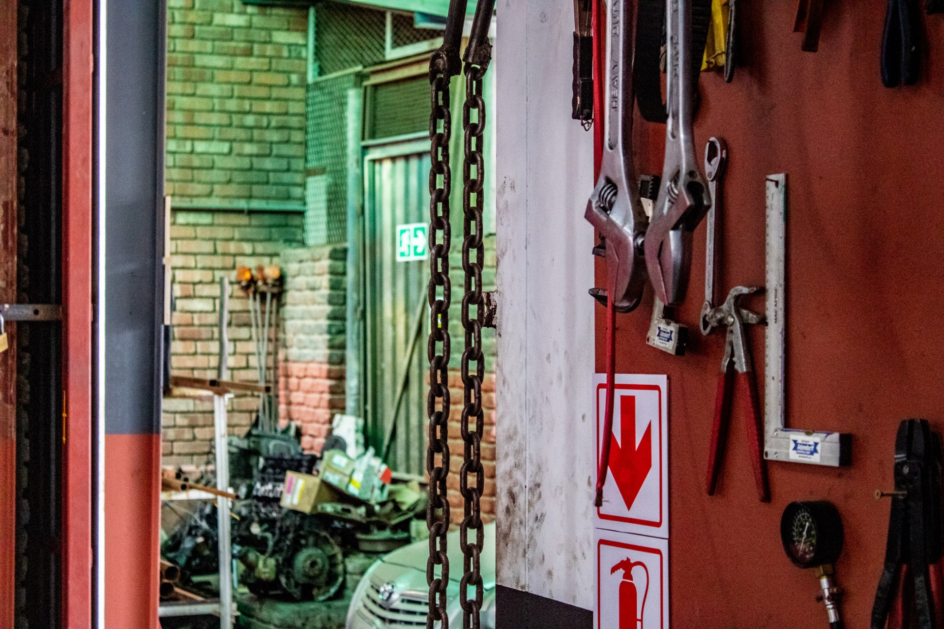 Lifting chains and tool wall inside the workshop